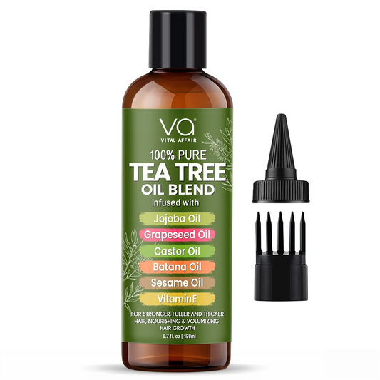 Tea tree oil hair oil blend bottle with a black cap and green label on a white background