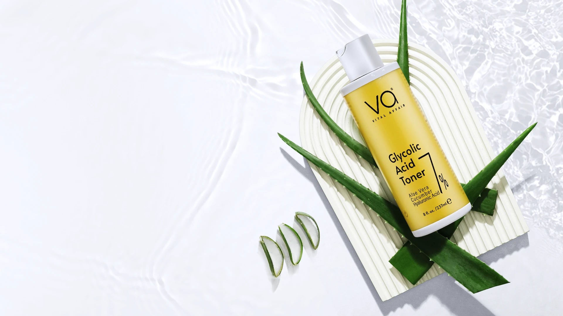 Vital Affair Gycolic Acid Toner with aloe vera and cucumber on a water surface