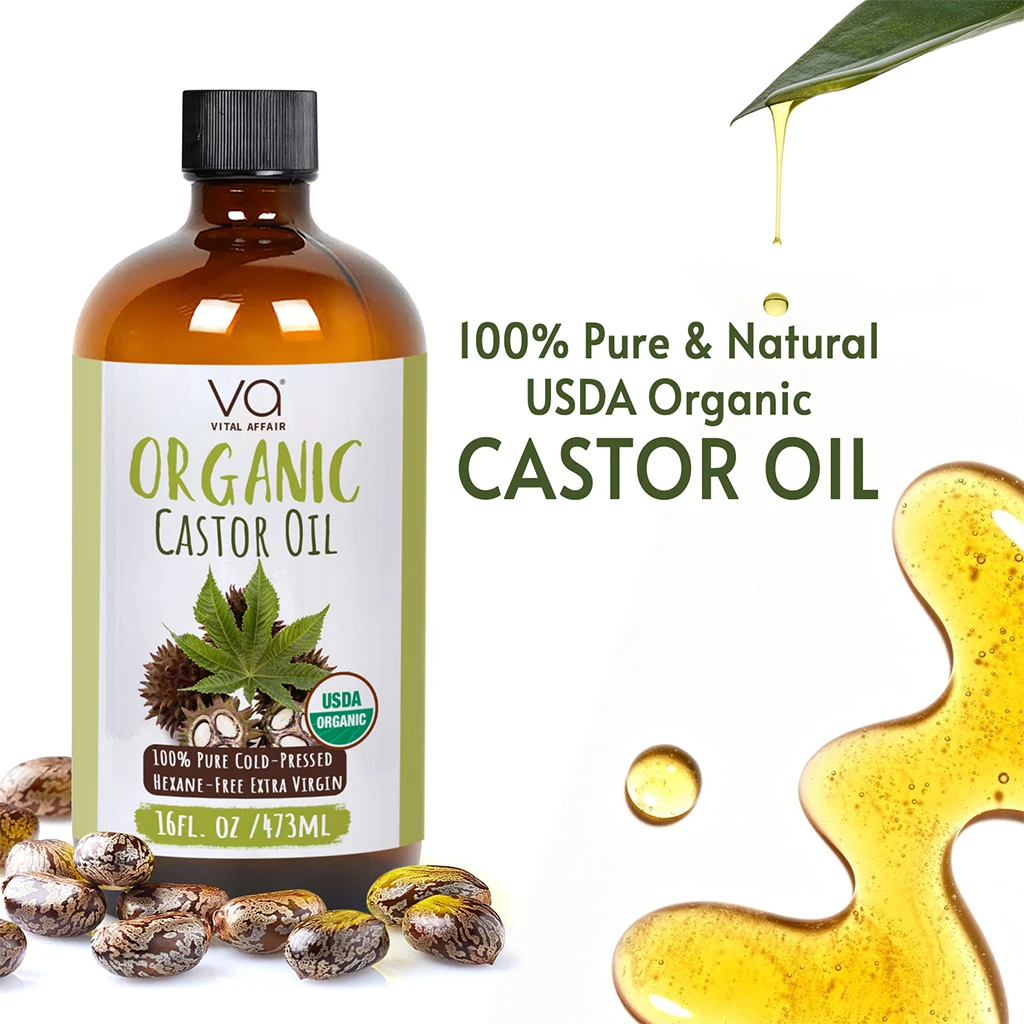 Bottle of Organic Castor Oil with label, castor beans, and oil droplets on a white background