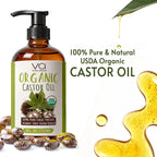 Bottle of Vital Affair Organic Castor Oil with pump, surrounded by castor beans and oil droplets on a white background.