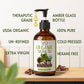 Bottle of Vital Affair organic castor oil with label details on a wooden surface.