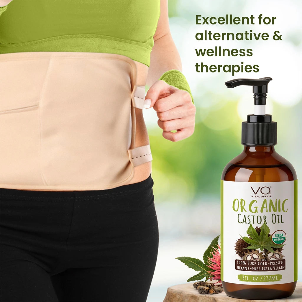 Person wearing a castor oil wrap pack with a bottle of Organic Castor Oil on a natural background Vital Affair