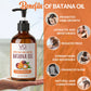 Brown bottle of VA Vital Affair Batana Oil with benefits listed on an orange background
