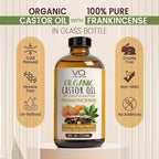 Organic castor oil with frankincense oil  in a glass bottle on a beige background