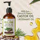 Bottle of organic castor oil with rosemary oil on a beige background with rosemary leaves and seeds.