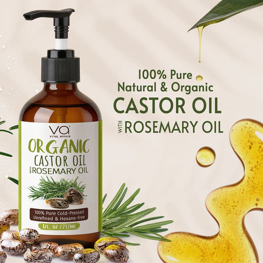 Bottle of organic castor oil with rosemary oil on a beige background with rosemary leaves and seeds.