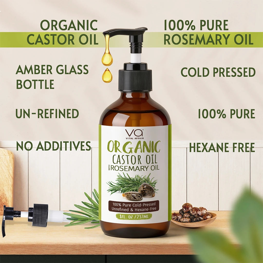 Bottle of organic castor oil and rosemary oil with label details on a wooden surface.