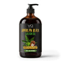 A 16 fl oz amber glass pump bottle of Vital Affair Jamaican Black Castor Oil, featuring a black label with green, yellow, and white text and illustrations of castor leaves and a rambutan fruit.