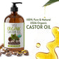 Bottle of Vital Affair organic castor oil with label, surrounded by castor beans and oil droplets on a white background.