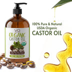 Bottle of Vital Affair organic castor oil with label, surrounded by castor beans and oil droplets on a white background.