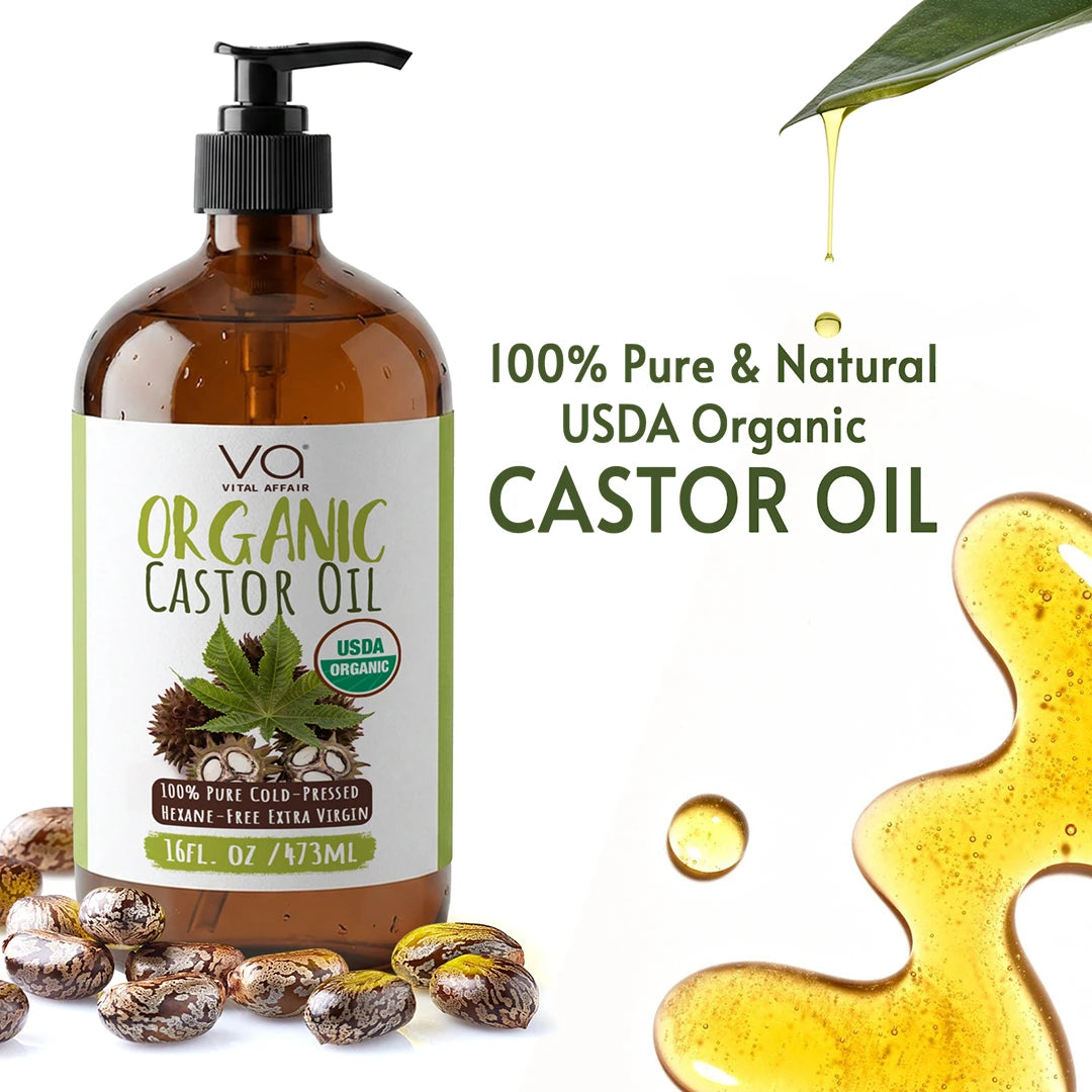 Bottle of Vital Affair organic castor oil with label, surrounded by castor beans and oil droplets on a white background.