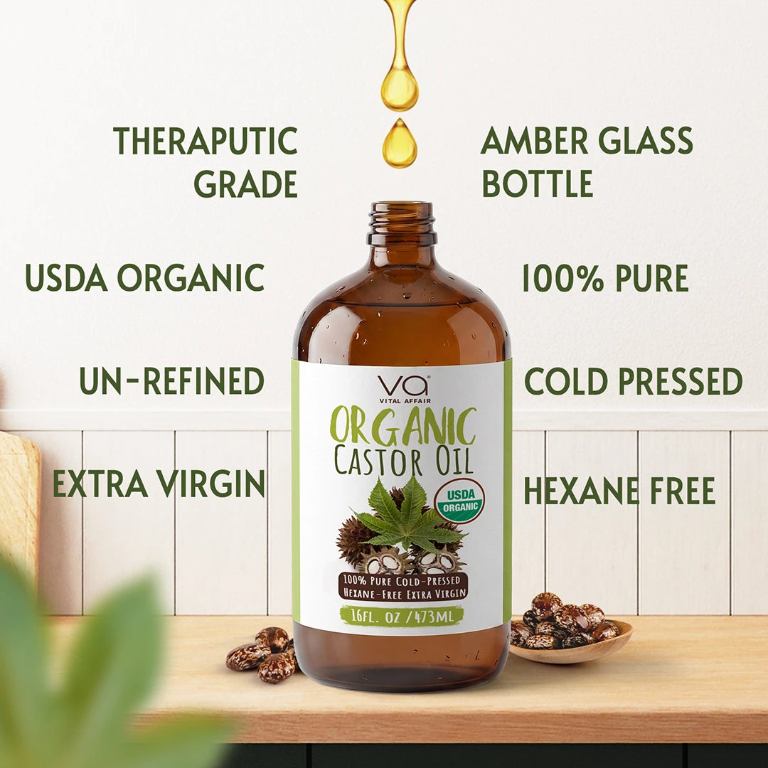 Bottle of  Vital Affair organic castor oil with labels highlighting its features on a wooden surface.