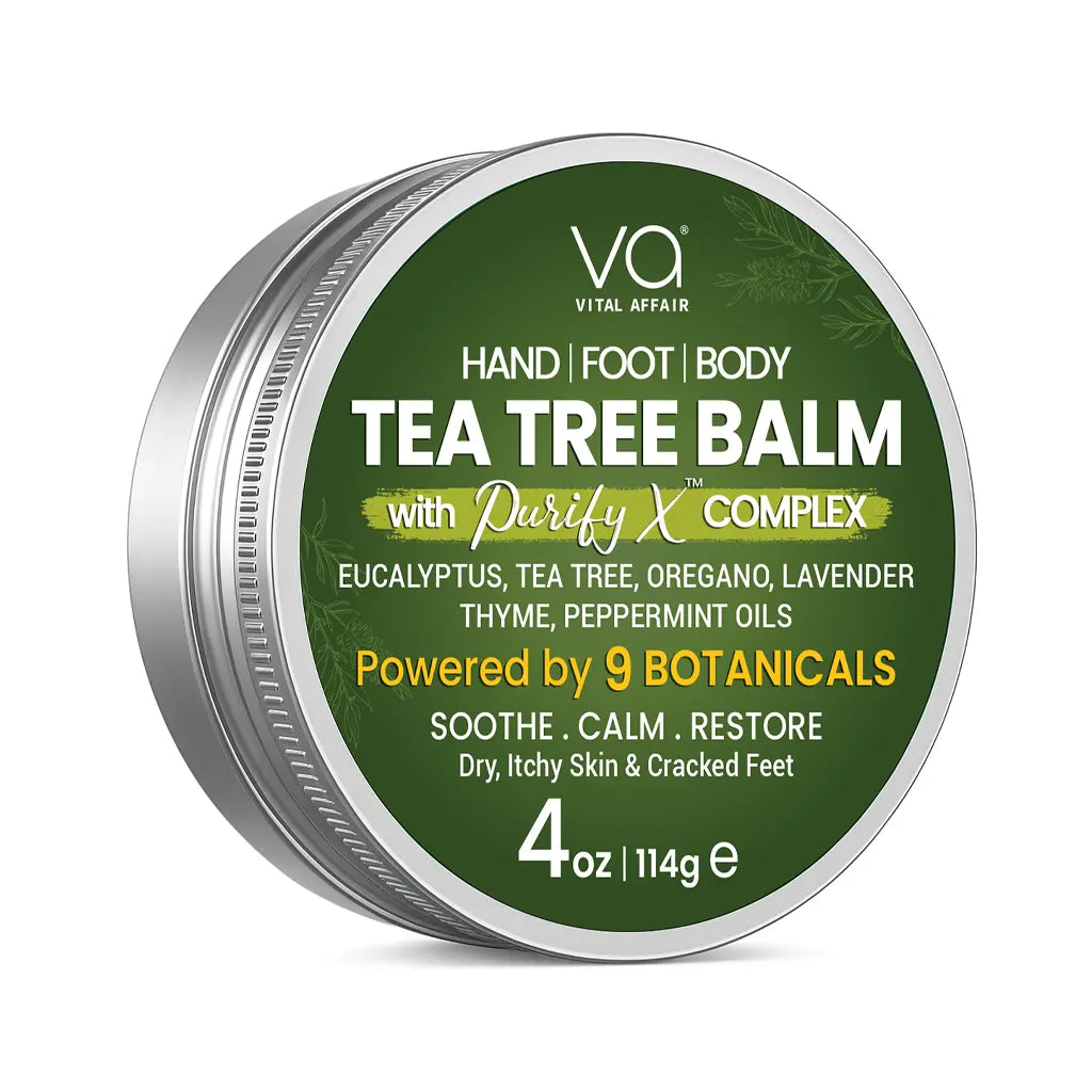 A round silver metal tin of Vital Affair Tea Tree Balm on a white background. The lid features a dark green label with white, yellow, and light green text detailing the ingredients and product benefits.